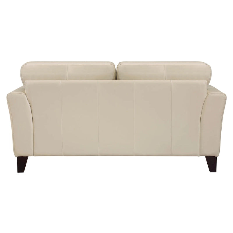 Loveseat de cuero color crema con patas de madera color espresso